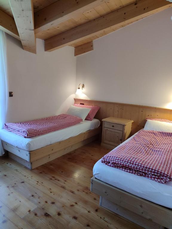 Postel nebo postele na pokoji v ubytování Appartamenti Residence Rodolon