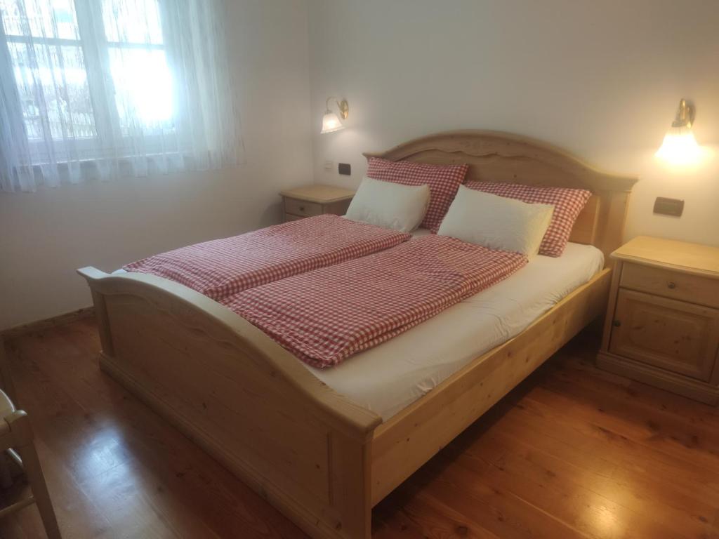 Postel nebo postele na pokoji v ubytování Appartamenti Residence Rodolon