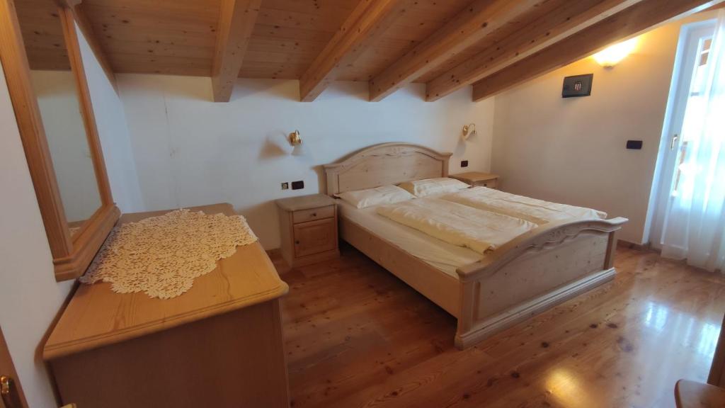 Postel nebo postele na pokoji v ubytování Appartamenti Residence Rodolon