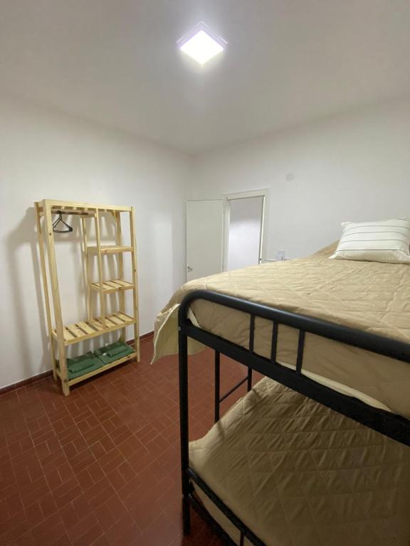 a room with two bunk beds and a mirror at Departamento Centro in Concepción del Uruguay