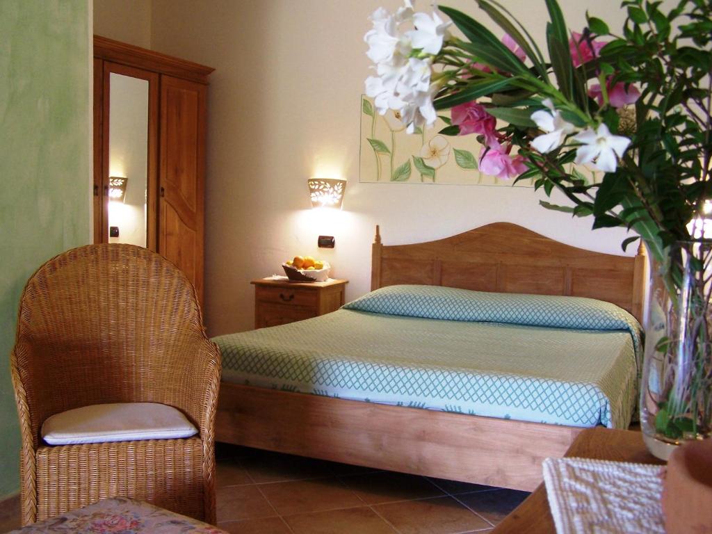Postel nebo postele na pokoji v ubytování Hotel Club Ragno D'oro