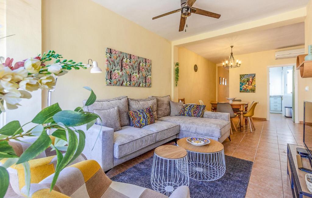 a living room with a couch and a table at Awesome Apartment In Santiago De La Ribera With Kitchen in Santiago de la Ribera