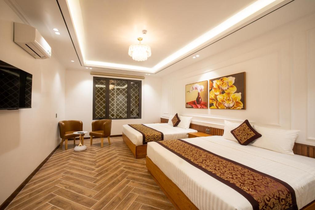 Giường trong phòng chung tại La Fleur Premium Central Apartment Hotel