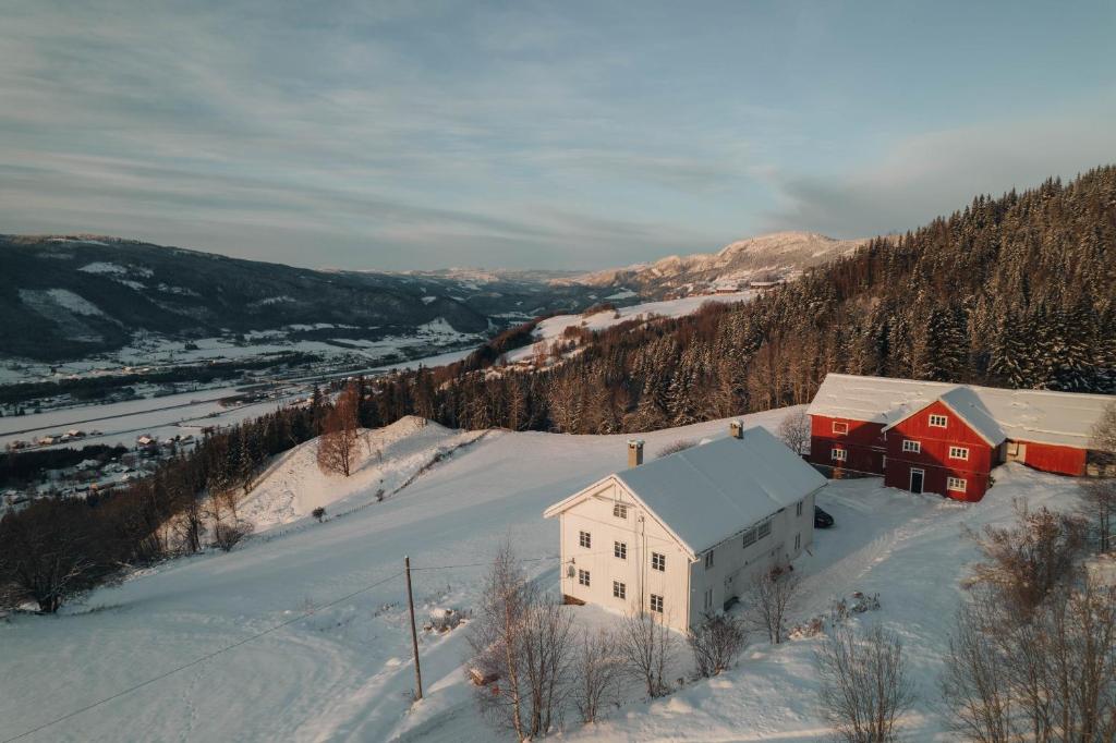 a house in the snow on a snowy hill at Hafjell Farmhouse in Øyer