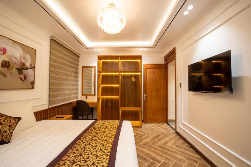 Giường trong phòng chung tại La Fleur Premium Central Apartment Hotel