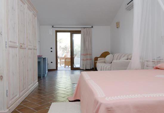 Postel nebo postele na pokoji v ubytování Hotel Club Ragno D'oro
