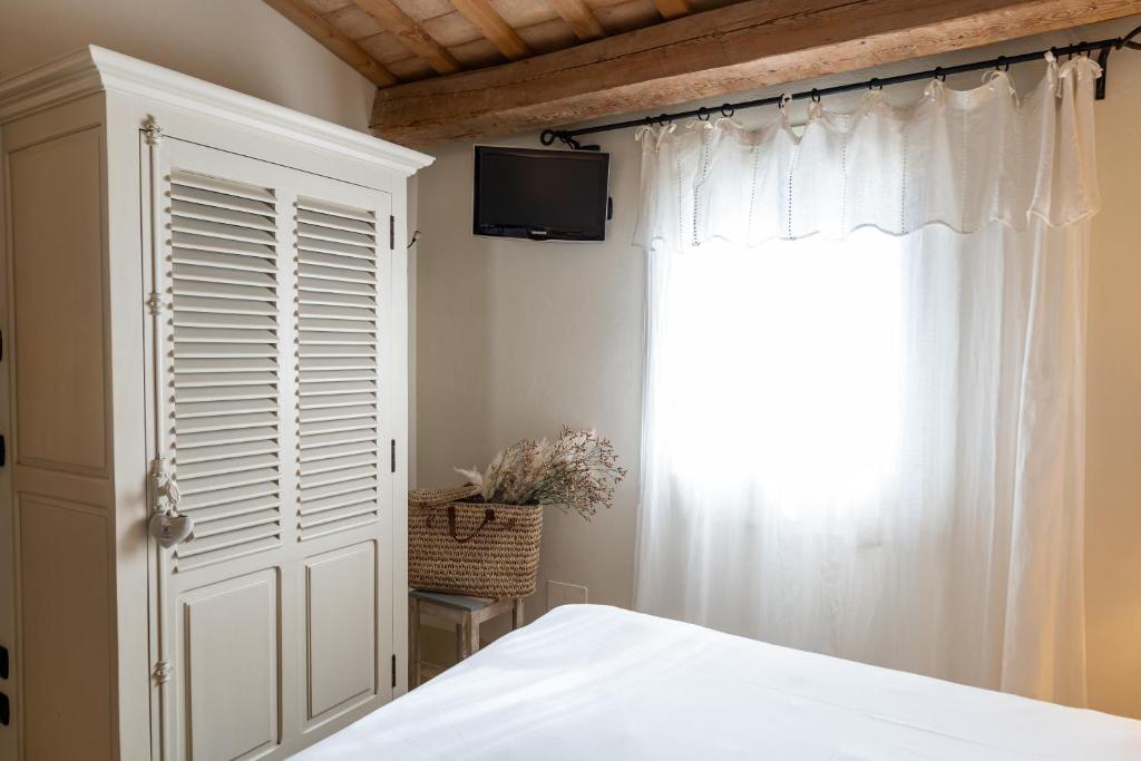 Postel nebo postele na pokoji v ubytování Casina Le Conserve