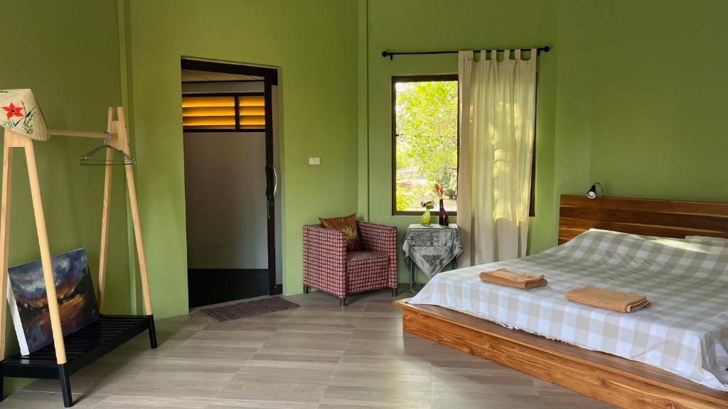 Postel nebo postele na pokoji v ubytování Navari Homestay