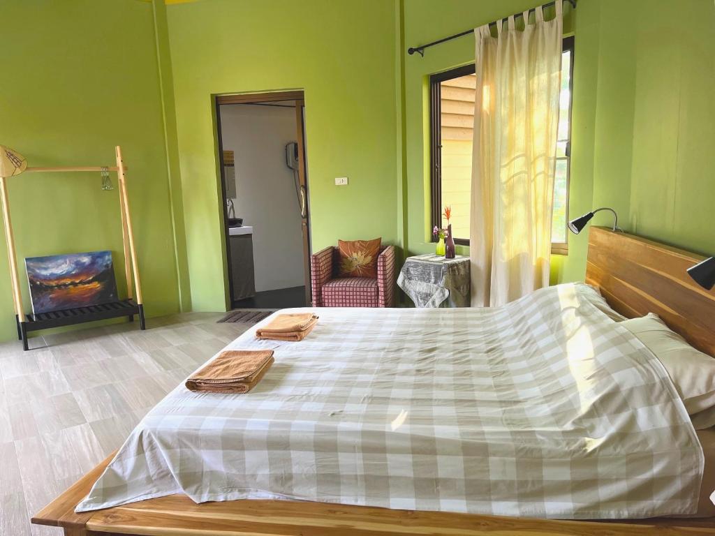 Postel nebo postele na pokoji v ubytování Navari Homestay