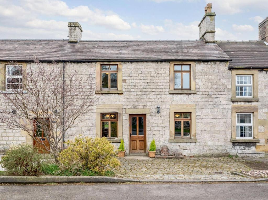 an old stone house with a driveway at 3 Bed in Hartington 54215 in Hartington