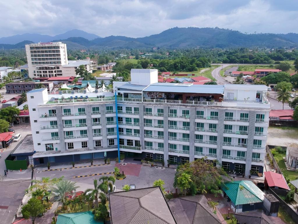 an aerial view of a building in a city at Langkapuri Resort Langkawi in Pantai Cenang