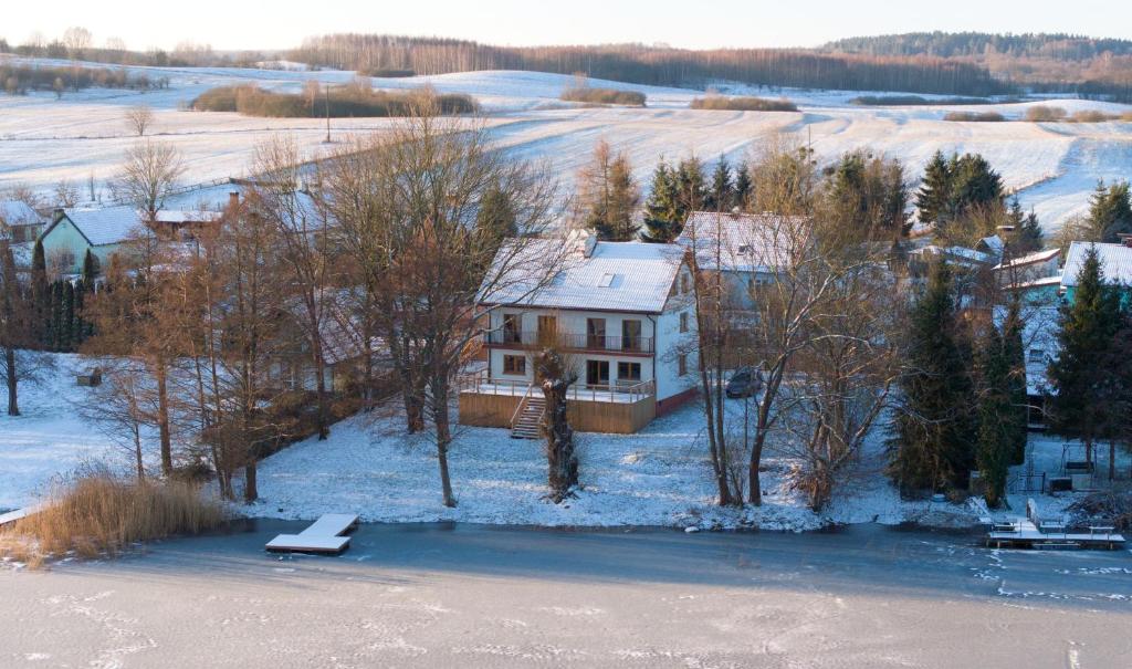 an aerial view of a house in the snow at Kaktus in Pasym