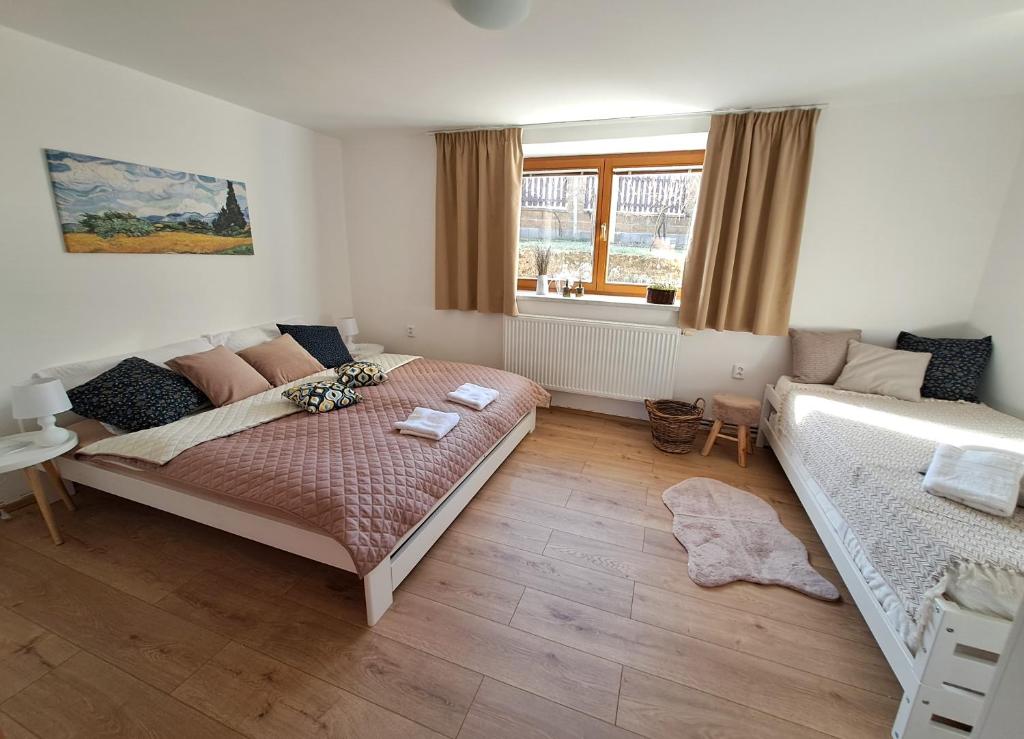 Postel nebo postele na pokoji v ubytování Domek na vinohradech