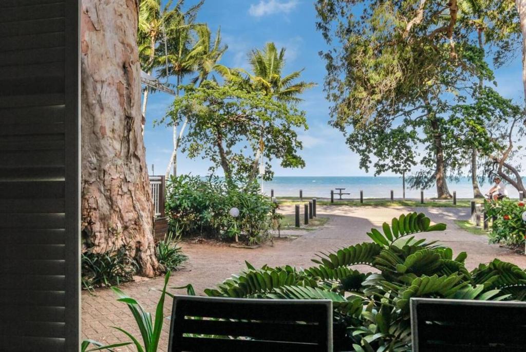 a view of the beach from a house at Mai at Coral Horizons: A Relaxed Beach Retreat in Palm Cove