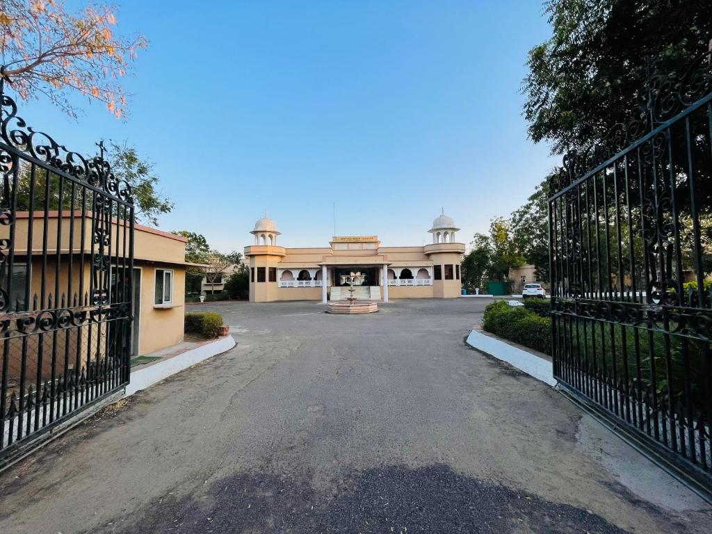 a house with a gate in front of a driveway at Heritage Resort Bikaner in Bikaner