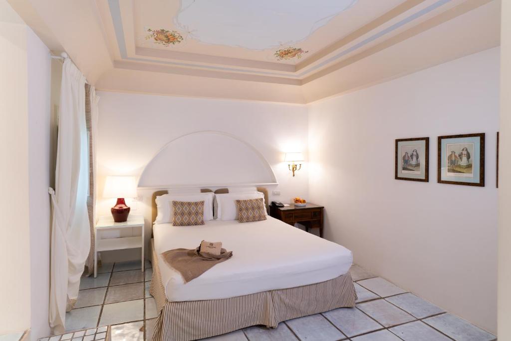 Postel nebo postele na pokoji v ubytování Masseria Il Melograno