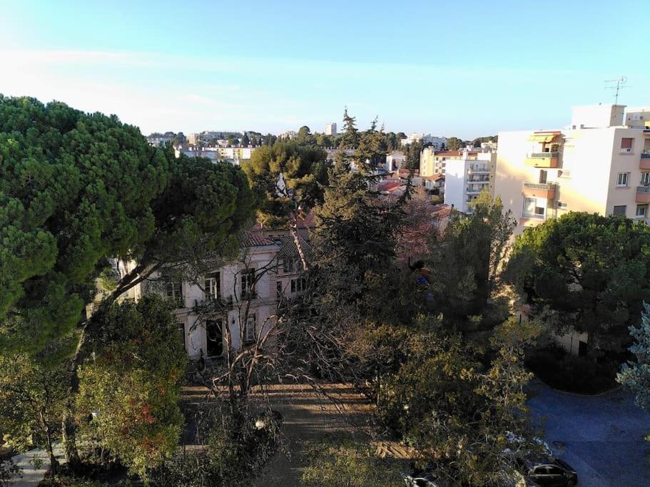 an overhead view of a city with trees and buildings at Appart T3 Spacieux + Terrasse in Montpellier