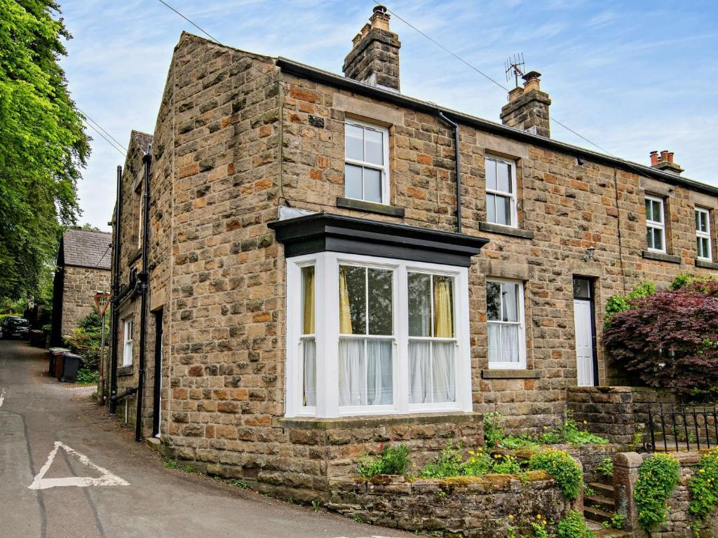 a brick house with a white window on a street at 3 Bed in Bamford PK838 in Bamford