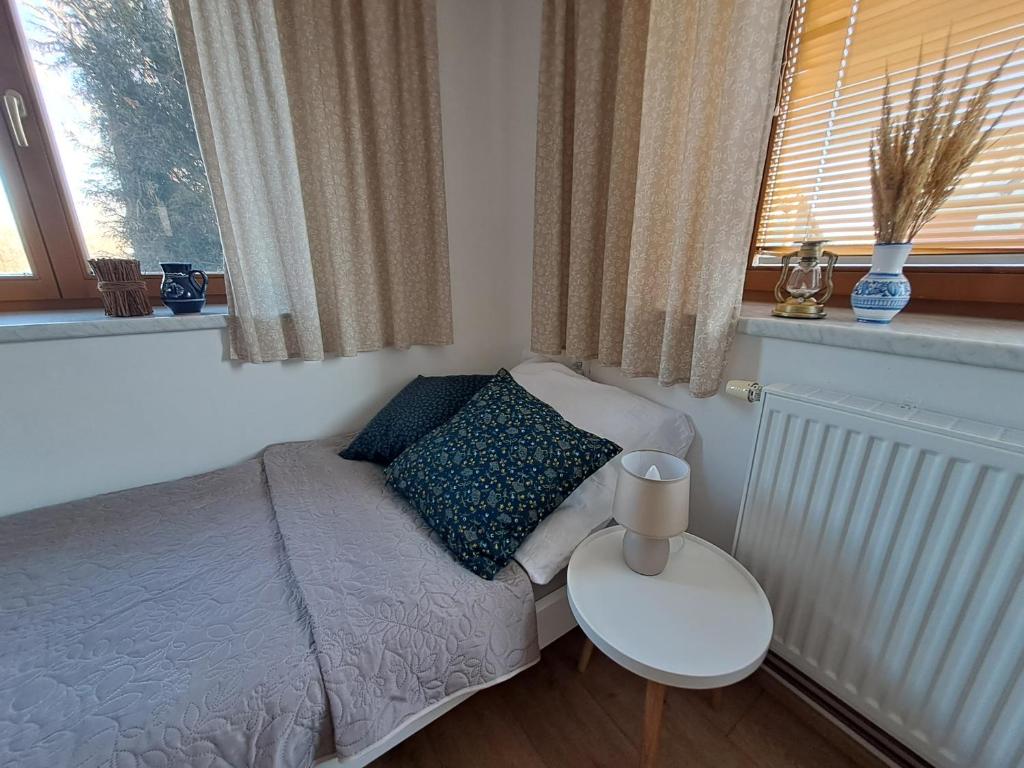 Postel nebo postele na pokoji v ubytování Domek na vinohradech