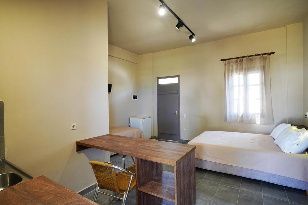 Postel nebo postele na pokoji v ubytování Alekos Studios