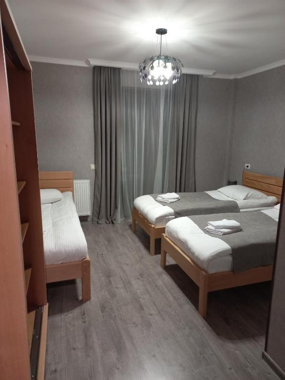 Postel nebo postele na pokoji v ubytování Margiansha House მარგიანშა სახლი