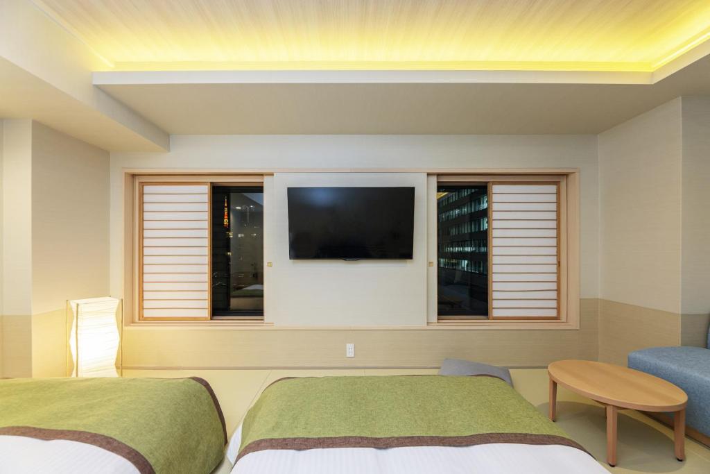 Postel nebo postele na pokoji v ubytování Bayside Hotel Azur Takeshiba
