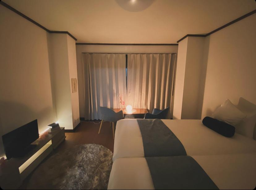 Letto o letti in una camera di THE MOON Atami