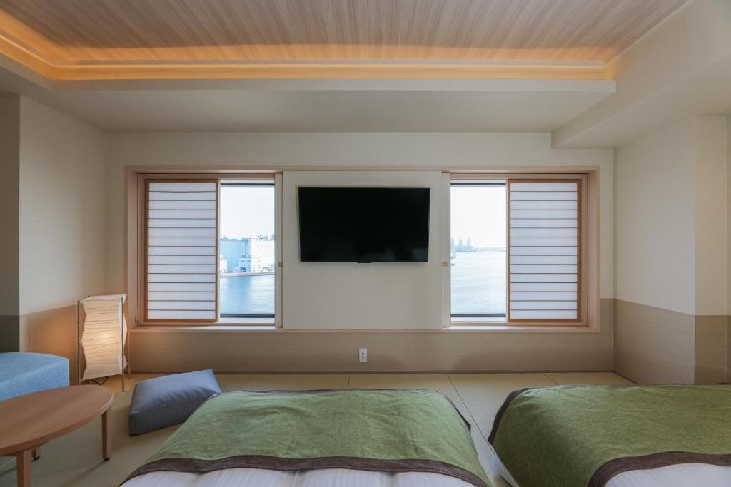 Postel nebo postele na pokoji v ubytování Bayside Hotel Azur Takeshiba