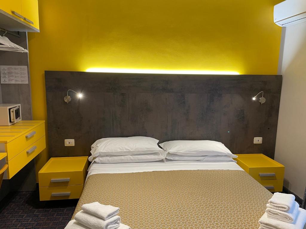 Postel nebo postele na pokoji v ubytování Hotel Lukas