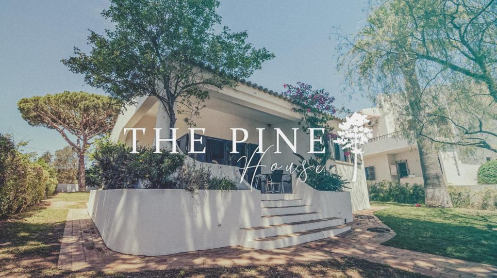 a house with a sign that reads the prince at Pine House - Faro Airport, Beach and City Center in Faro
