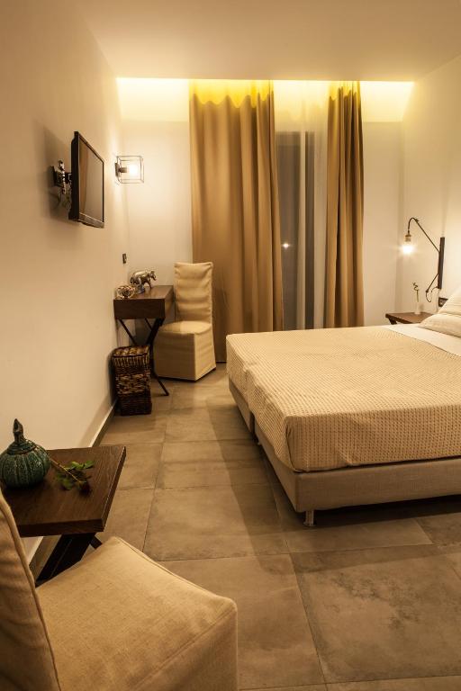 Postel nebo postele na pokoji v ubytování Anemos Rooms & Apartments