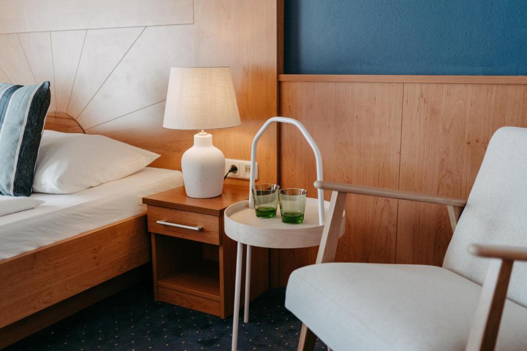 Postel nebo postele na pokoji v ubytování Hotel Greif