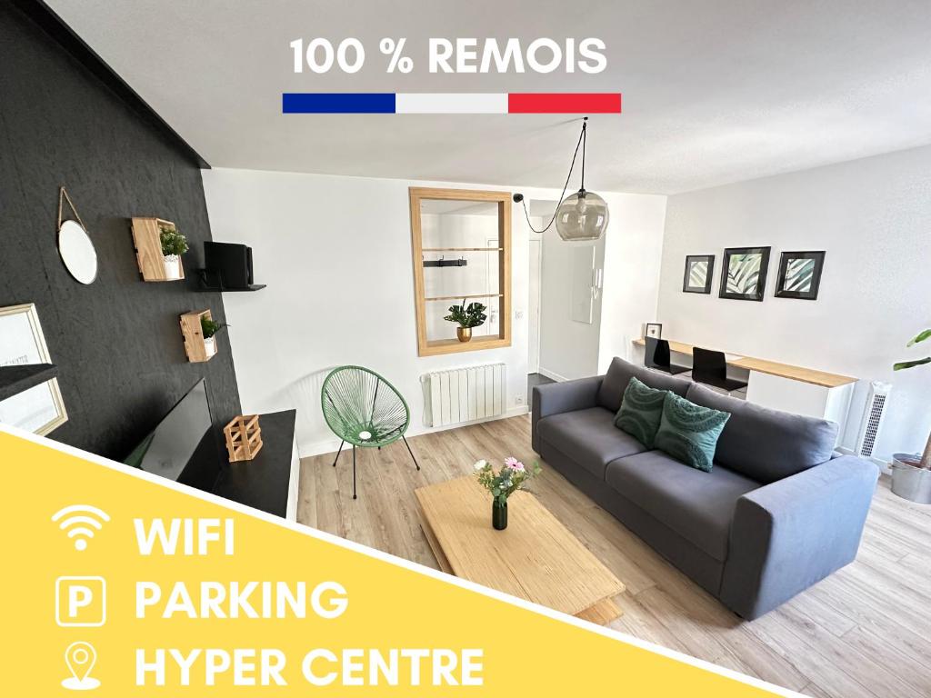 sala de estar con sofá gris en Le Forum - HYPER centre - PARKING, en Reims