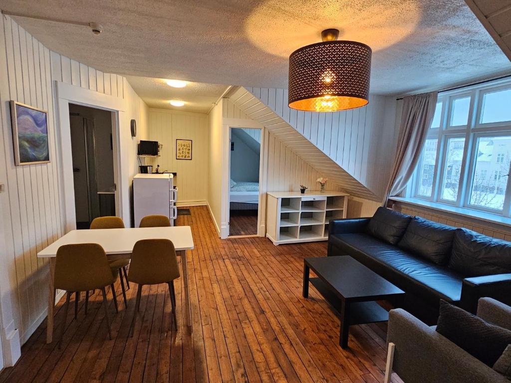 a living room with a couch and a table at Downtown Guesthouse Reykjavik in Reykjavík