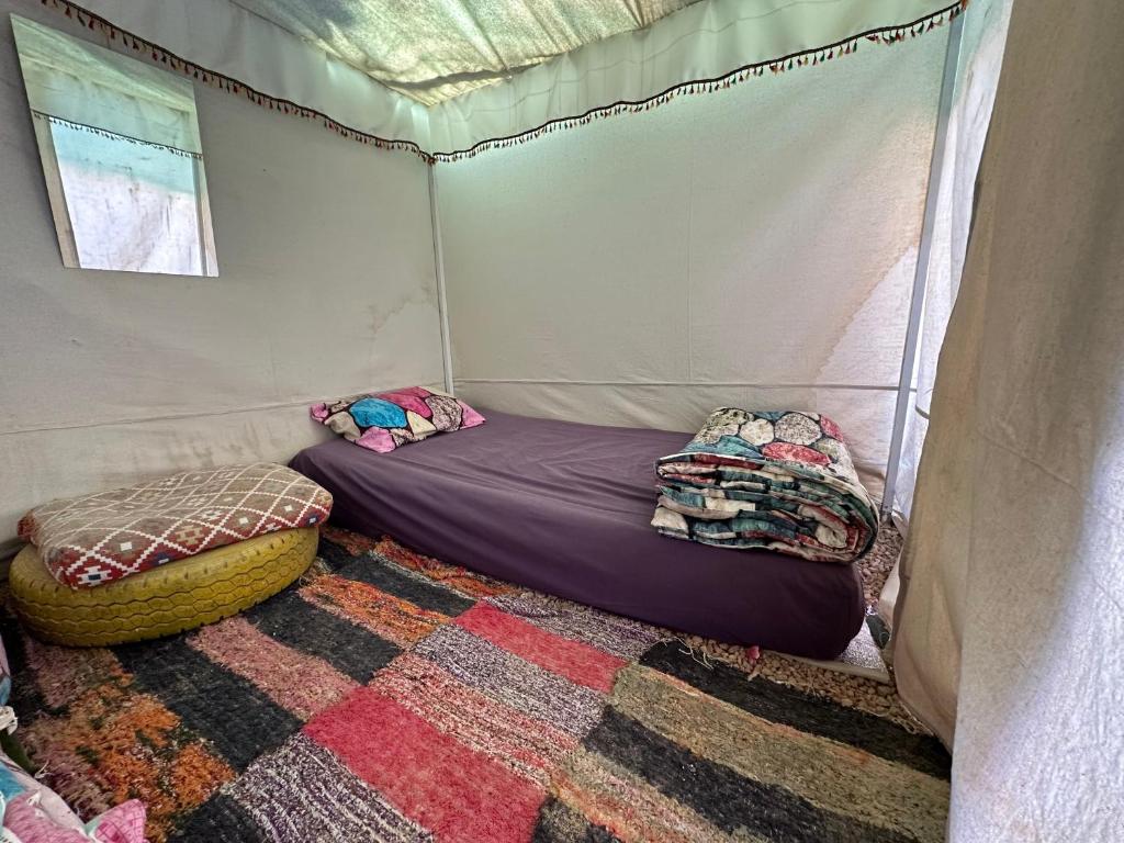 a room with two beds in a tent at Muhra Camp Siwa in Siwa