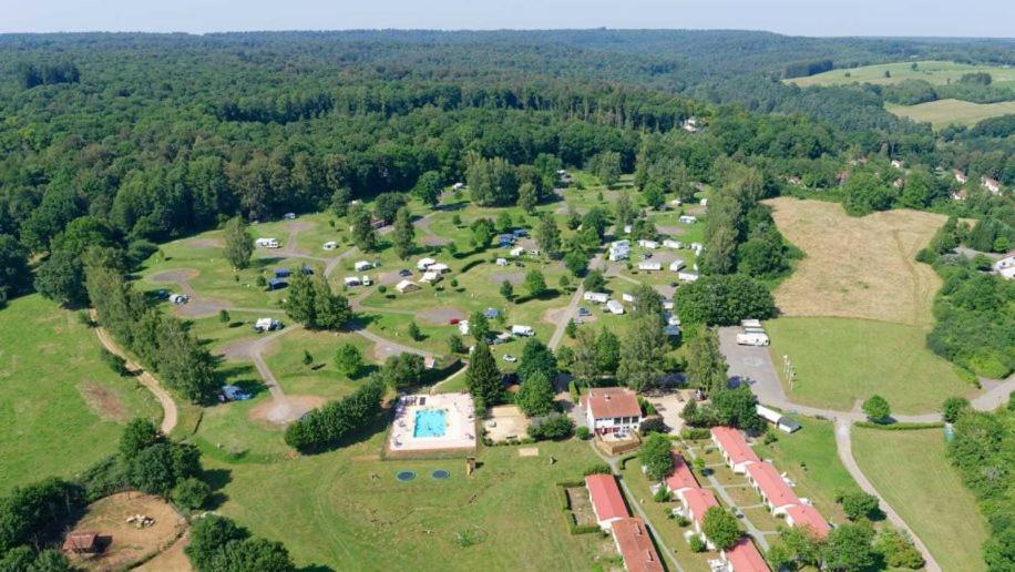 an aerial view of a park with a group of houses at Glamping Virton in Virton