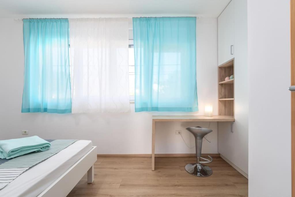 Postel nebo postele na pokoji v ubytování Villa Blue Valica