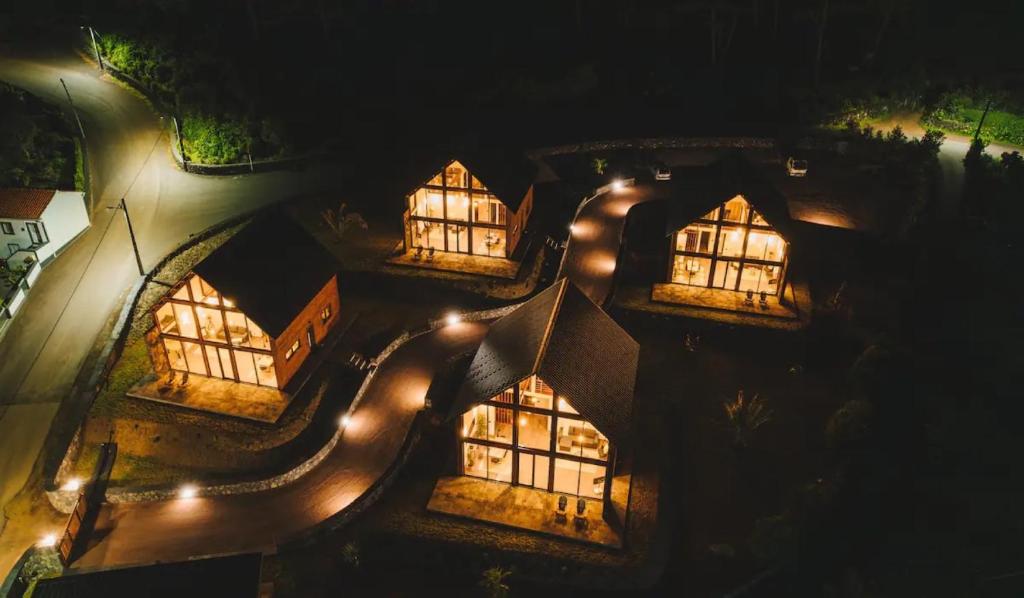 an overhead view of a building at night with lights at Cabanas do Pico 1b in São Roque do Pico