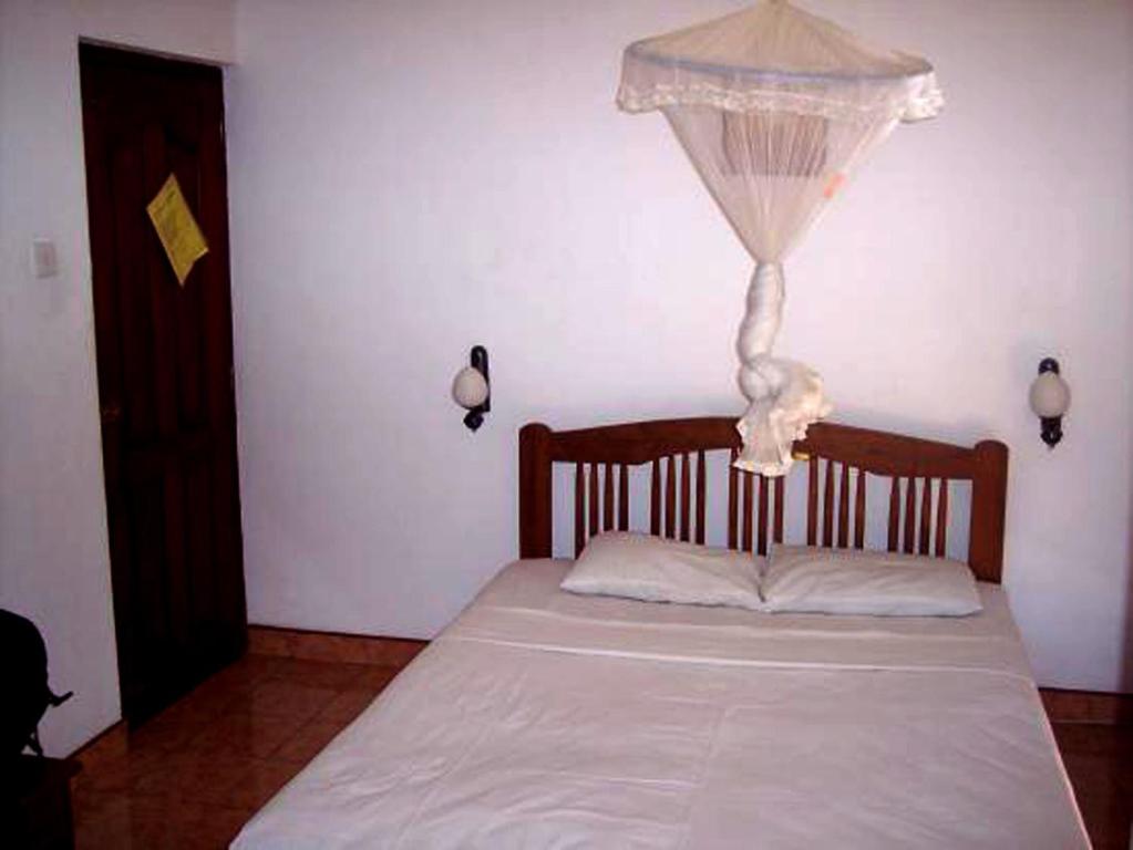 Postel nebo postele na pokoji v ubytování Amila Guest