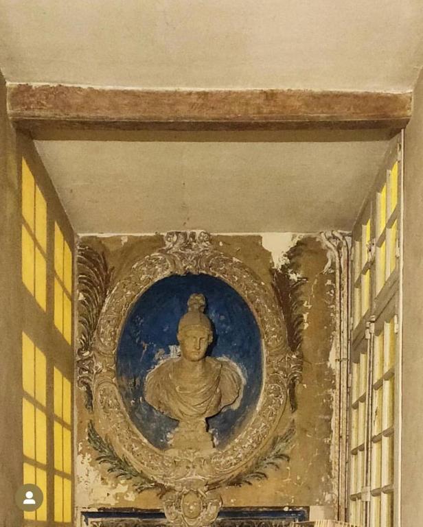 a painting of a buddha on a wall at La Maison Saint Joseph in Crépy-en-Valois