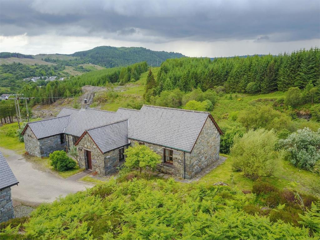 an overhead view of a stone building on a hill at 2 bed property in Cairnbaan CA113 in Cairnbaan