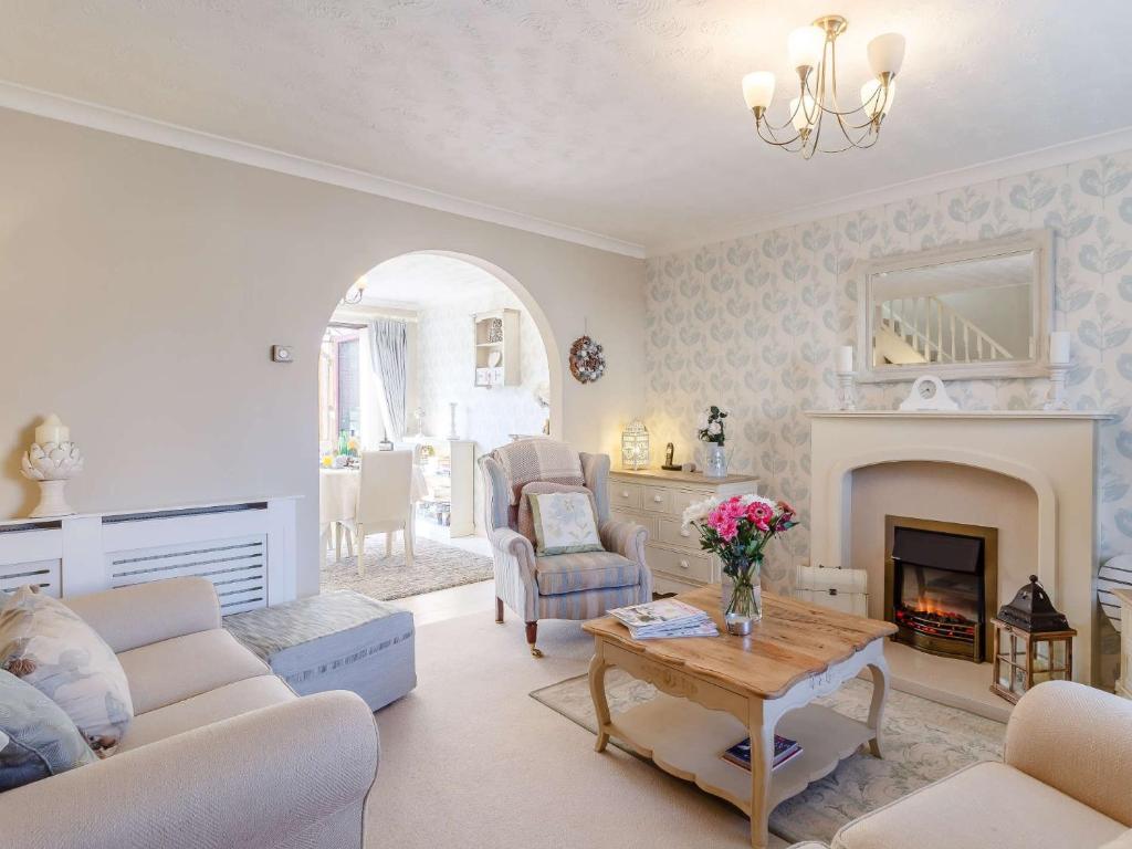 a living room with a couch and a fireplace at 3 Bed in Dereham 87159 in East Dereham