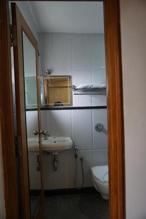 Koupelna v ubytování Kingscross Residency