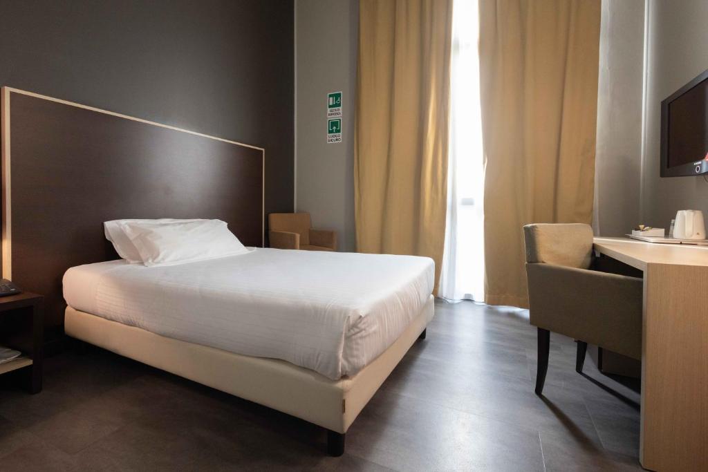 Postel nebo postele na pokoji v ubytování Art Hotel Olympic