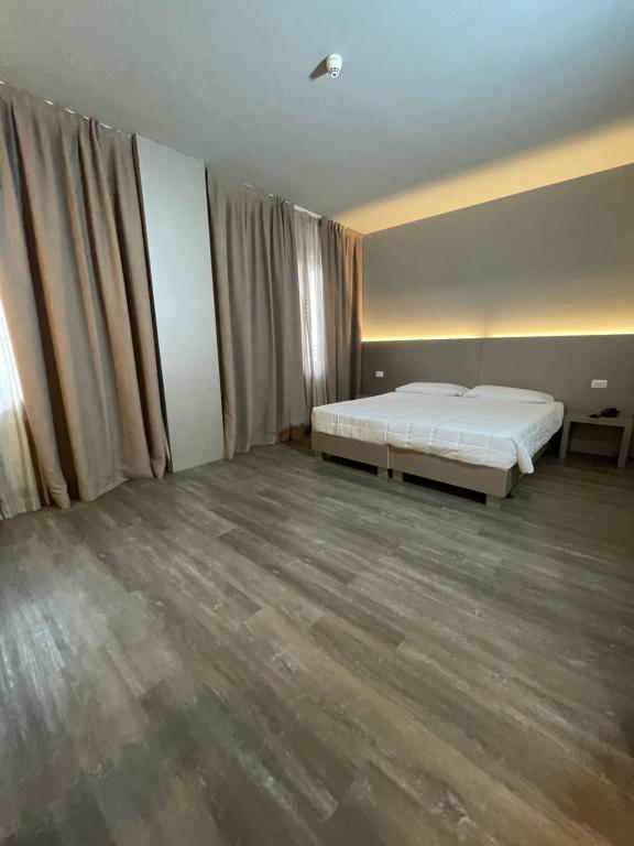 Postel nebo postele na pokoji v ubytování Hotel Albatros