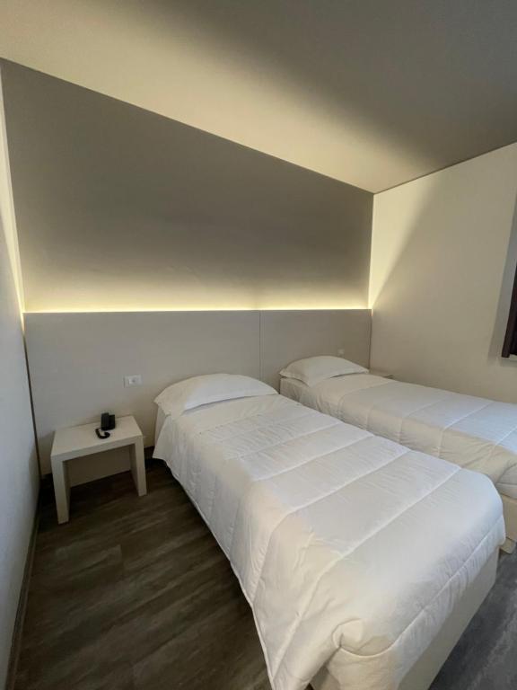 Postel nebo postele na pokoji v ubytování Hotel Albatros