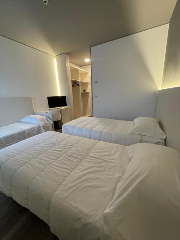 Postel nebo postele na pokoji v ubytování Hotel Albatros