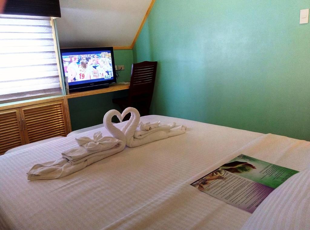 Postel nebo postele na pokoji v ubytování Shore Time Hotel Boracay