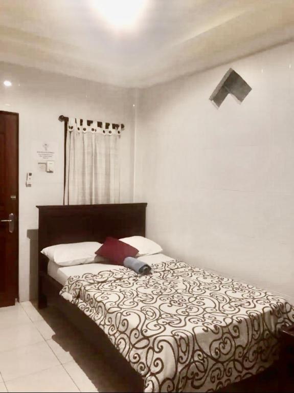 Postel nebo postele na pokoji v ubytování Banana Home Stay Ubud