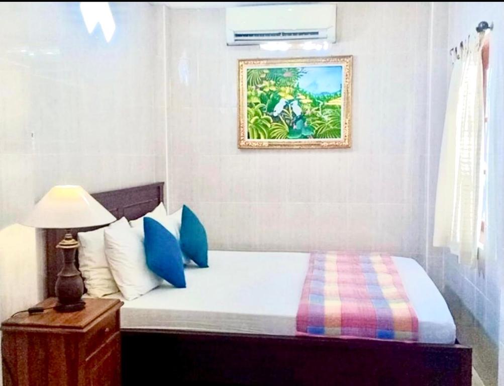 Postel nebo postele na pokoji v ubytování Banana Home Stay Ubud
